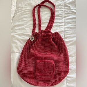The Sak Crochet Drawstring Backpack in a Unique Sequoia Red Color.